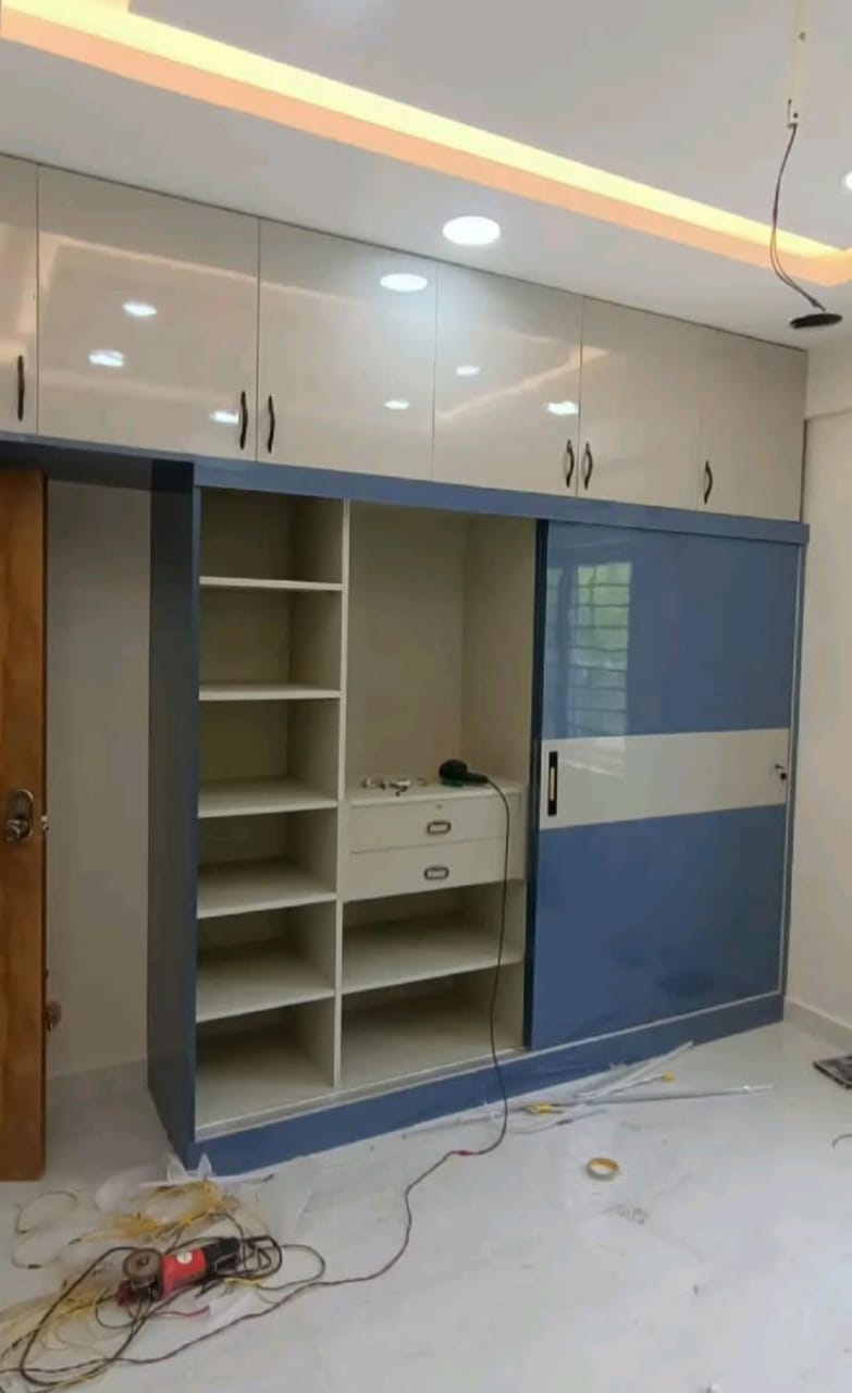 Floor-to-ceiling sliding wardrobe by VS Furnitures Indore